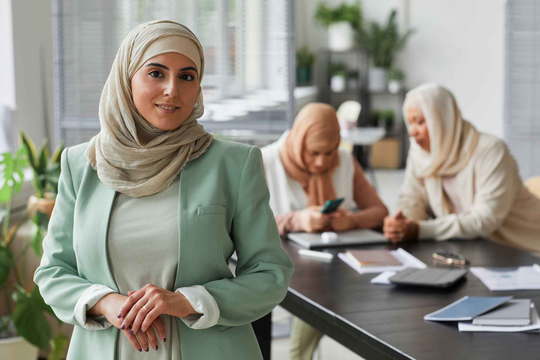 A woman business leader working with her management team
